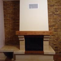 Cheminée Pierre du Gard et poutre chene