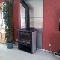 Poêle Sopraz avec protection murale inox